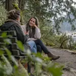 Counsellor listening to a client on a park bench in North Vancouver